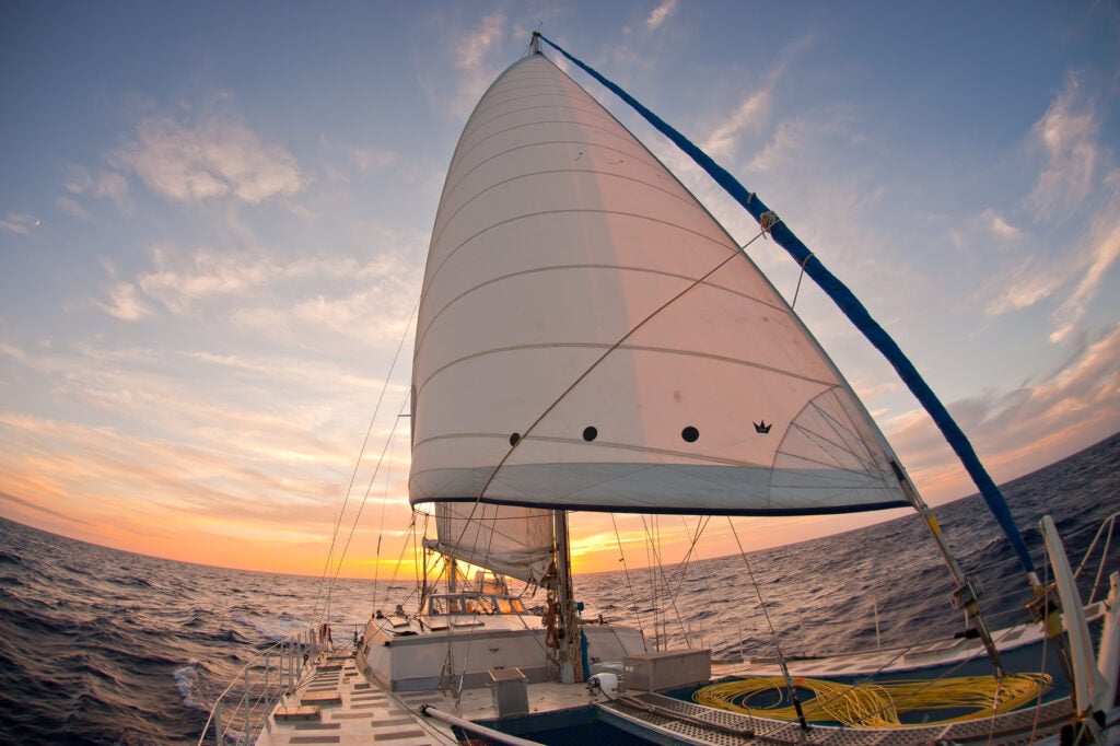 The Ranger sailing in the sunset with jib and main sail hoisted. Crossing from Gorringe Bank to Alborán Sea