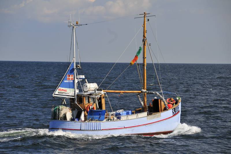 Small trawler sailing. Rose, Sweden. Oceana Hanse Explorer Baltic Sea Expedition. April 2011.